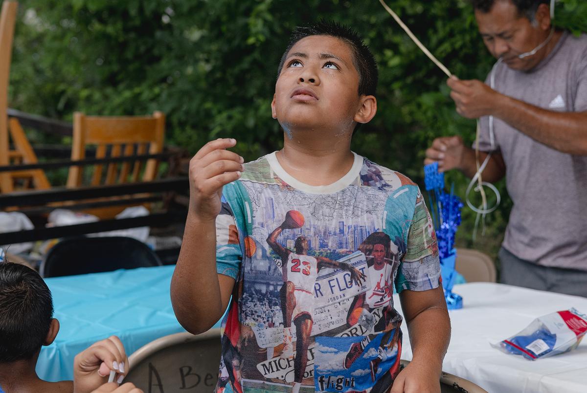 The Ávila family celebrate Jeremiah’s birthday with a waterslide in José’s backyard, Friday, June 6, 2025, in Houston. (Lexi Parra for The Texas Tribune)